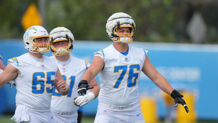 Jun 13, 2024; Costa Mesa, CA, USA; Los Angeles Chargers center Brent Laing (65), guard Karsen Barnhart (61) and offensive tackle Joe Alt (76) during minicamp at the Hoag Performance Center. Mandatory Credit: Kirby Lee-USA TODAY Sports