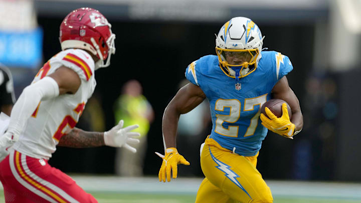 Sep 29, 2024; Inglewood, California, USA; Los Angeles Chargers running back J.K. Dobbins (27) carries the ball in the first quarter against the Kansas City Chiefs at SoFi Stadium. Mandatory Credit: Kirby Lee-Imagn Images