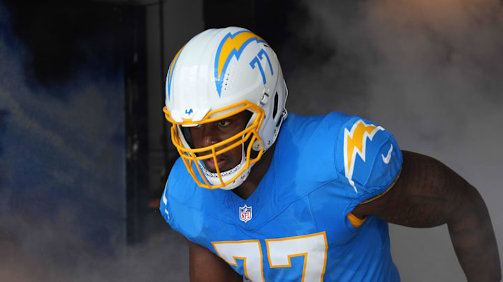 Sep 8, 2024; Inglewood, California, USA; Los Angeles Chargers guard Zion Johnson (77) enters the field before the game against the Las Vegas Raiders at SoFi Stadium. Mandatory Credit: Kirby Lee-Imagn Images