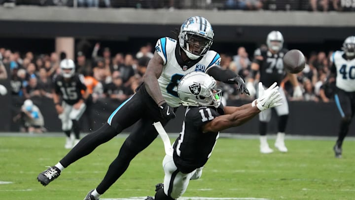 Sep 22, 2024; Paradise, Nevada, USA; Las Vegas Raiders wide receiver Tre Tucker (11) attempts to catch the ball against Carolina Panthers cornerback Jaycee Horn (8) in the second half at Allegiant Stadium. Mandatory Credit: Kirby Lee-Imagn Images Sep 22, 2024; Paradise, Nevada, USA; Las Vegas Raiders wide receiver Tre Tucker (11) attempts to catch the ball against Carolina Panthers cornerback Jaycee Horn (8) in the second half at Allegiant Stadium. Mandatory Credit: Kirby Lee-Imagn Images