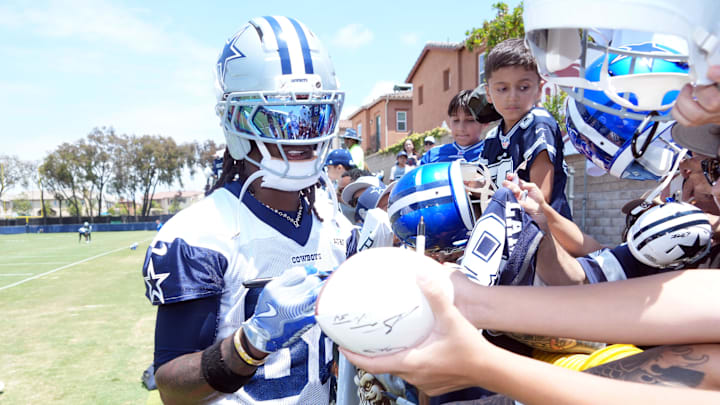 Dallas Cowboys receiver CeeDee Lamb signs autographs during training camp at the River Ridge Fields. Dallas Cowboys receiver CeeDee Lamb signs autographs during training camp at the River Ridge Fields.