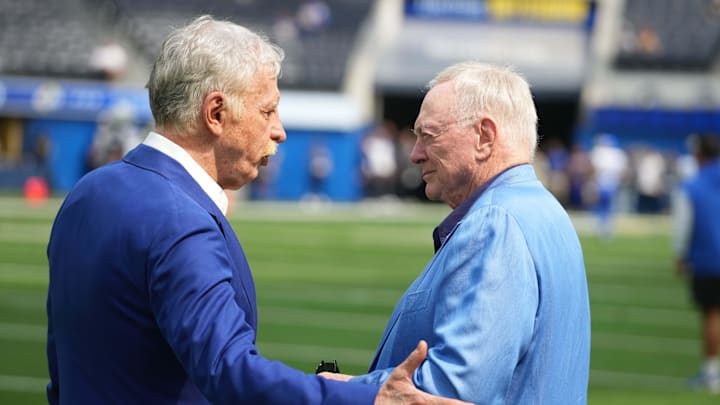 Los Angeles Rams owner Stan Kroenke talks with Dallas Cowboys owner Jerry Jones during the game at SoFi Stadium. 