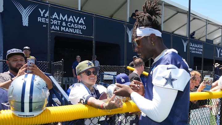 Dallas Cowboys linebacker DeMarvion Overshown signs autographs at training camp at the River Ridge Fields. Dallas Cowboys linebacker DeMarvion Overshown signs autographs at training camp at the River Ridge Fields.
