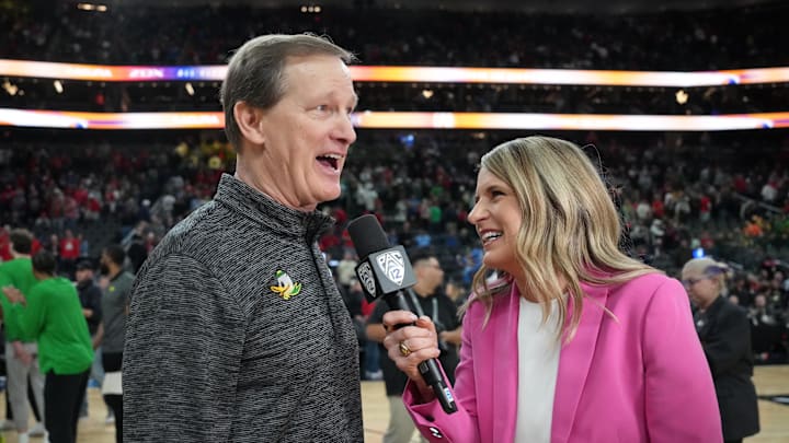 Mar 15, 2024; Las Vegas, NV, USA; Pac-12 Networks reporter Elise Woodward (right) interviews Oregon Ducks head coach Dana Altman after a game against the Arizona Wildcats at T-Mobile Arena. Mandatory Credit: Kirby Lee-Imagn Images
