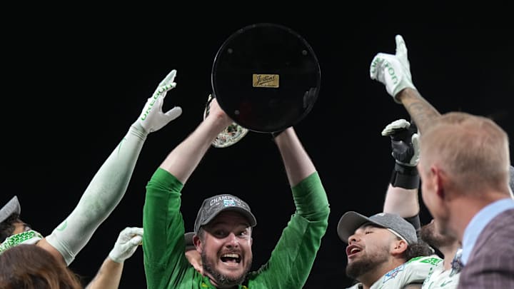 Dec 28, 2022; San Diego, CA, USA; Oregon Ducks head coach Dan Lanning celebrates with the championship trophy after the 2022 Holiday Bowl against the North Carolina Tar Heels at Petco Park. Mandatory Credit: Kirby Lee-Imagn Images