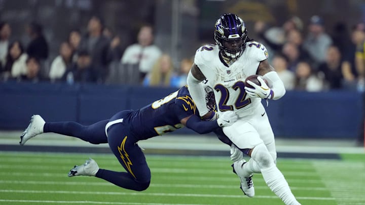 Baltimore Ravens running back Derrick Henry (22) carries the ball against Los Angeles Chargers. Baltimore Ravens running back Derrick Henry (22) carries the ball against Los Angeles Chargers.