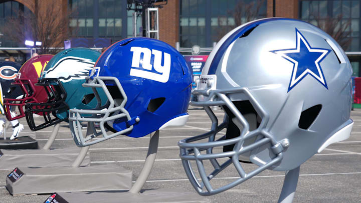 Feb 27, 2025; Indianapolis, IN, USA; NFC East helmets of the Dallas Cowboys, New York Giants, Philadelphia Eagles and Washington Commanders at the 2025 NFL Scouting Combine Experience at Lucas Oil Stadium. 
