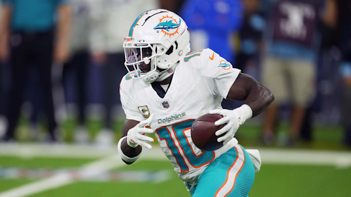 Miami Dolphins wide receiver Tyreek Hill (10) carries the ball against the Los Angeles Rams in the second half at SoFi Stadium. 