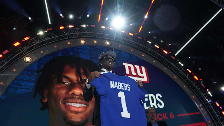 Apr 25, 2024; Detroit, MI, USA; LSU Tigers wide receiver Malik Nabers poses with jersey after being selected as the No. 8 pick by the New York Giants during the 2024 NFL Draft. Apr 25, 2024; Detroit, MI, USA; LSU Tigers wide receiver Malik Nabers poses with jersey after being selected as the No. 8 pick by the New York Giants during the 2024 NFL Draft.