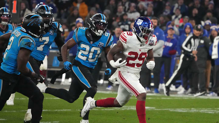 Nov 10, 2024; Munich, Germany; New York Giants running back Tyrone Tracy Jr. (29) carries the ball on a 32-yard touchdown run against the New York Giants in the second half during the 2024 NFL Munich Game at Allianz Arena. Mandatory Credit: Kirby Lee-Imagn Images