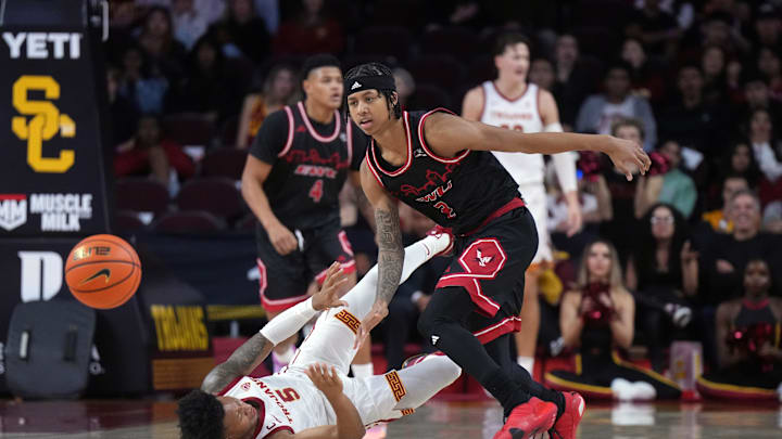 Nov 29, 2023; Los Angeles, California, USA Southern California Trojans guard Boogie Ellis (5) and Eastern Washington Eagles guard Mason Williams (2) battle for the ball in the first half at Galen Center.