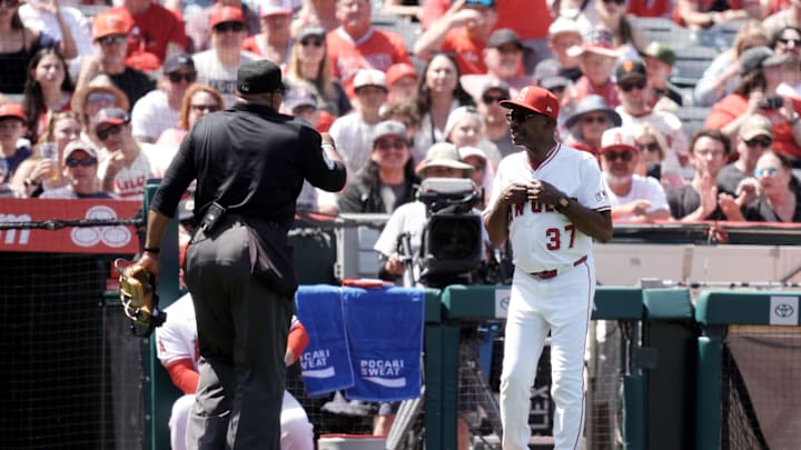 Apr 20, 2025; Anaheim, California, USA;  Los Angeles Angels manager Ron Washington (37) talks with home plate umpire in the fourth inning against the San Francisco Giants at Angel Stadium. Mandatory Credit: Kirby Lee-Imagn Images
