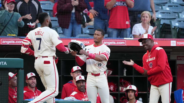 May 8, 2025; Anaheim, California, USA; Los Angeles Angels right fielder Jo Adell (7) is presented a fire fighter helmet by center fielder Kyren Paris (19) as manager Ron Washington watches after hitting a home run in the second inning against the Toronto Blue Jays at Angel Stadium. Mandatory Credit: Kirby Lee-Imagn Images May 8, 2025; Anaheim, California, USA; Los Angeles Angels right fielder Jo Adell (7) is presented a fire fighter helmet by center fielder Kyren Paris (19) as manager Ron Washington watches after hitting a home run in the second inning against the Toronto Blue Jays at Angel Stadium. Mandatory Credit: Kirby Lee-Imagn Images