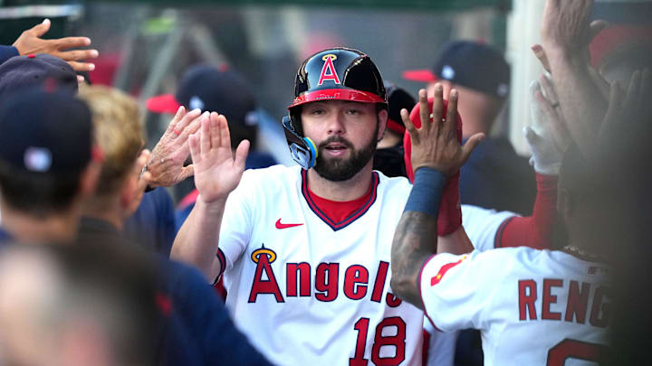 Jul 11, 2025; Anaheim, California, USA; Los Angeles Angels first baseman Nolan Schanuel (18) is greeted by teammates after scoring in the first inning against the Arizona Diamondbacks at Angel Stadium. Mandatory Credit: Kirby Lee-Imagn Images