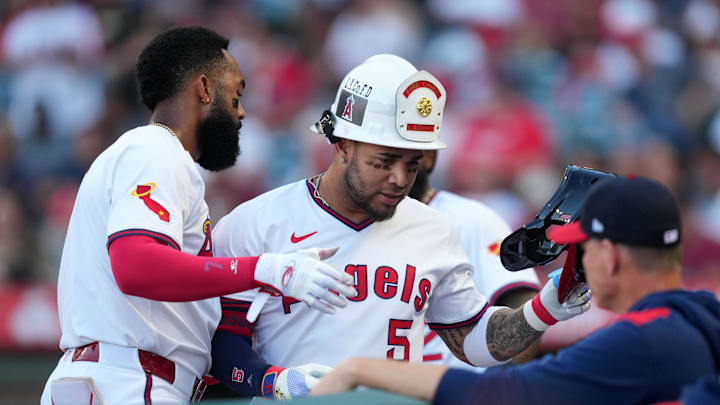Angels third baseman Yoan Moncada (5) is congratulated by center fielder Jo Adell (7) after hitting a two-run home run in the first inning against the Arizona Diamondbacks at Angel Stadium on July 11.