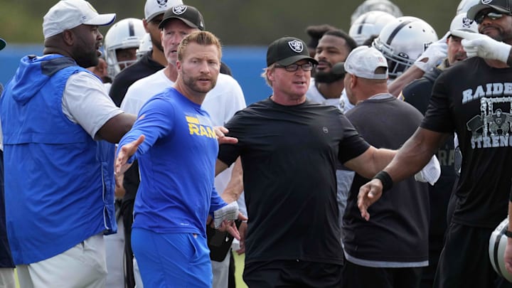 Aug 19, 2021; Thousand Oaks, CA, USA; Los Angeles Rams coach Sean McVay (left) and Las Vegas Raiders coach Jon Gruden break up a fight during a joint practice. Mandatory Credit: Kirby Lee-Imagn Images