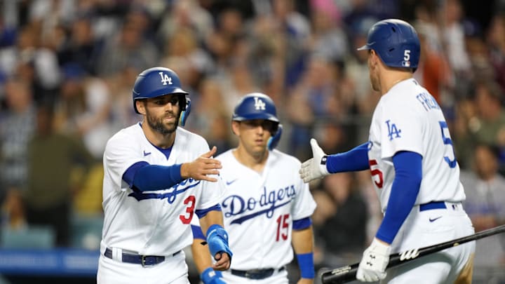 May 16, 2022; Los Angeles, California, USA; Los Angeles Dodgers catcher Austin Barnes (15) and designated hitter Chris Taylor (3) are congratulated by first baseman Freddie Freeman (5) after scoring in the fifth inning against the Arizona Diamondbacks at Dodger Stadium. Mandatory Credit: Kirby Lee-Imagn Images