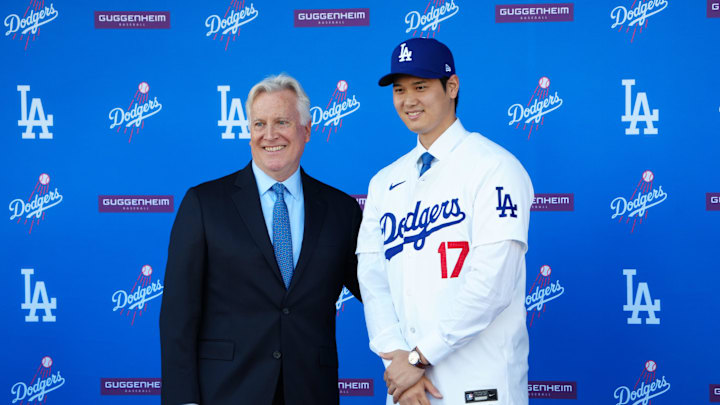 Dec 14, 2023; Los Angeles, CA, USA; Los Angeles Dodgers designated hitter Shohei Ohtani (17) poses with owner Mark Walter at press conference at Dodger Stadium. Mandatory Credit: Kirby Lee-Imagn Images