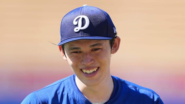 Aug 8, 2025; Los Angeles, California, USA; Los Angeles Dodgers pitcher Roki Sasaki (11) reacts before the game against the Toronto Blue Jays at Dodger Stadium. Mandatory Credit: Kirby Lee-Imagn Images