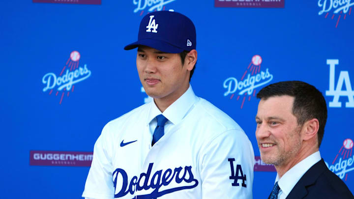 Dec 14, 2023; Los Angeles, CA, USA; Los Angeles Dodgers designated hitter Shohei Ohtani (left) poses with president of baseball operations Andrew Friedman during introductory press conference at Dodger Stadium. Mandatory Credit: Kirby Lee-Imagn Images Dec 14, 2023; Los Angeles, CA, USA; Los Angeles Dodgers designated hitter Shohei Ohtani (left) poses with president of baseball operations Andrew Friedman during introductory press conference at Dodger Stadium. Mandatory Credit: Kirby Lee-Imagn Images