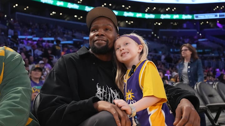 May 23, 2025; Los Angeles, California, USA; Kevin Durant poses with 8-year-old LA Sparks fan Vivian Havens during the game against the Golden State Valkyries at Crypto.com Arena. Mandatory Credit: Kirby Lee-Imagn Images May 23, 2025; Los Angeles, California, USA; Kevin Durant poses with 8-year-old LA Sparks fan Vivian Havens during the game against the Golden State Valkyries at Crypto.com Arena. Mandatory Credit: Kirby Lee-Imagn Images