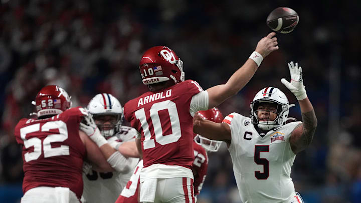 Jacob Manu applies pressure on Oklahoma's Jackson Arnold in the 2023 Alamo Bowl. Jacob Manu applies pressure on Oklahoma's Jackson Arnold in the 2023 Alamo Bowl.