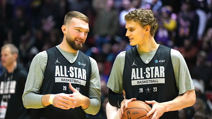 Feb 18, 2023; Salt Lake City, UT, USA; Domantas Sabonis (left) and Lauri Markkanen react during NBA All-Star Game practice at Huntsman Center. Mandatory Credit: Kirby Lee-Imagn Images