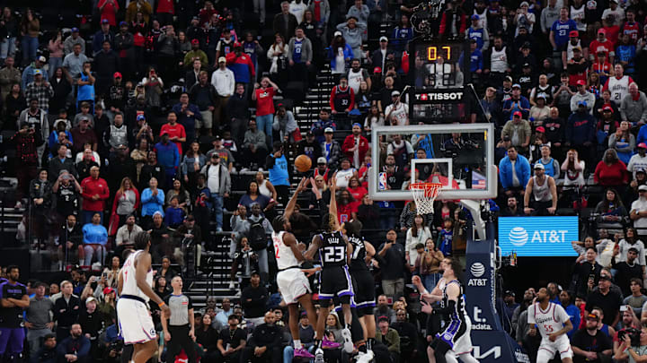 Mar 9, 2025; Inglewood, California, USA; LA Clippers forward Kawhi Leonard (2) shoots the game-winning shot against Sacramento Kings guard Keon Ellis (23) and center Jonas Valanciunas (17) in overtime at the Intuit Dome. Mandatory Credit: Kirby Lee-Imagn Images