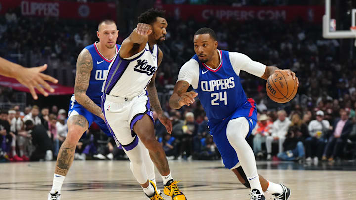Dec 6, 2023; Los Angeles, California, USA; LA Clippers guard Norman Powell (24) dribbles the ball against Sacramento Kings guard Malik Monk (0) in the first half at Crypto.com Arena. Mandatory Credit: Kirby Lee-Imagn Images Dec 6, 2023; Los Angeles, California, USA; LA Clippers guard Norman Powell (24) dribbles the ball against Sacramento Kings guard Malik Monk (0) in the first half at Crypto.com Arena. Mandatory Credit: Kirby Lee-Imagn Images
