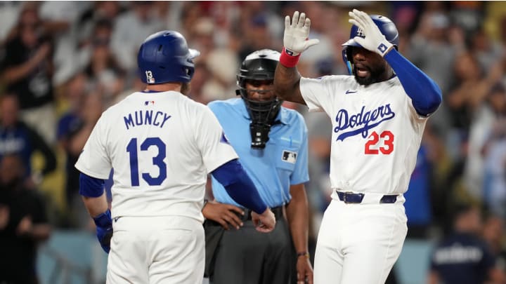 Los Angeles Dodgers right fielder Jason Heyward (23) celebrates with third baseman Max Muncy (13) after hitting a three-run home run in the eighth inning against the Seattle Mariners at Dodger Stadium on Aug 20. Los Angeles Dodgers right fielder Jason Heyward (23) celebrates with third baseman Max Muncy (13) after hitting a three-run home run in the eighth inning against the Seattle Mariners at Dodger Stadium on Aug 20.