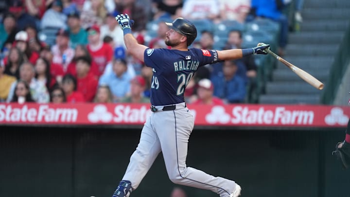 Seattle Mariners catcher Cal Raleigh (29) hits a three-run home run in the first inning against the Los Angeles Angels at Angel Stadium on June 7. Seattle Mariners catcher Cal Raleigh (29) hits a three-run home run in the first inning against the Los Angeles Angels at Angel Stadium on June 7.