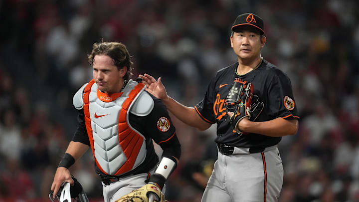 May 9, 2025; Anaheim, California, USA; Baltimore Orioles starting pitcher Tomoyuki Sugano (19) and catcher Adley Rutschman (35) react at the end of the seventh inning against the Los Angeles Angels  at Angel Stadium. Mandatory Credit: Kirby Lee-Imagn Images