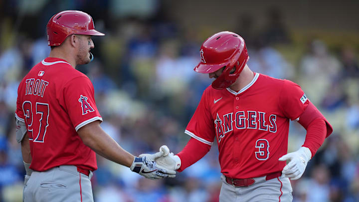 Angels outfielder Taylor Ward (3) is congratulated by outfielder Mike Trout (27) after hitting a home run in the third inning against the Los Angeles Dodgers at Dodger Stadium on March 23.