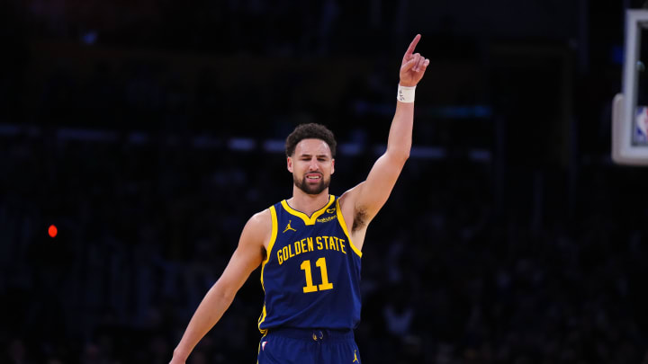 Apr 9, 2024; Los Angeles, California, USA; Golden State Warriors guard Klay Thompson (11) celebrates after a  three-point shot against the Los Angeles Lakers in the second half at Crypto.com Arena. Mandatory Credit: Kirby Lee-USA TODAY Sports