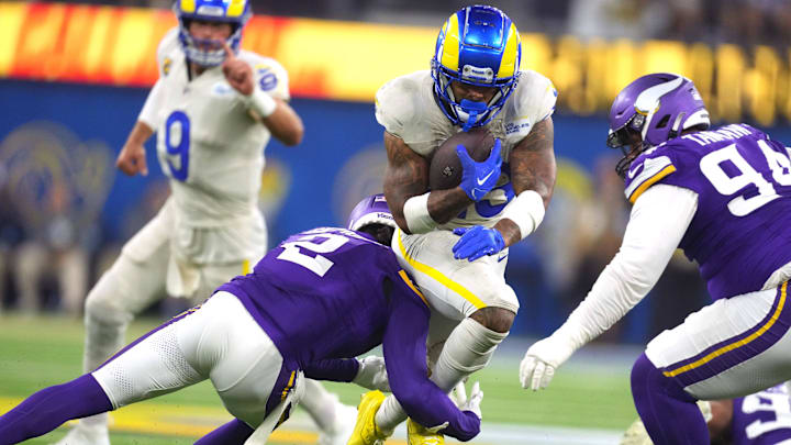 Oct 24, 2024; Inglewood, California, USA; Los Angeles Rams running back Kyren Williams (23) carries the ball against Minnesota Vikings cornerback Stephon Gilmore (2) in the second half at SoFi Stadium. Oct 24, 2024; Inglewood, California, USA; Los Angeles Rams running back Kyren Williams (23) carries the ball against Minnesota Vikings cornerback Stephon Gilmore (2) in the second half at SoFi Stadium.