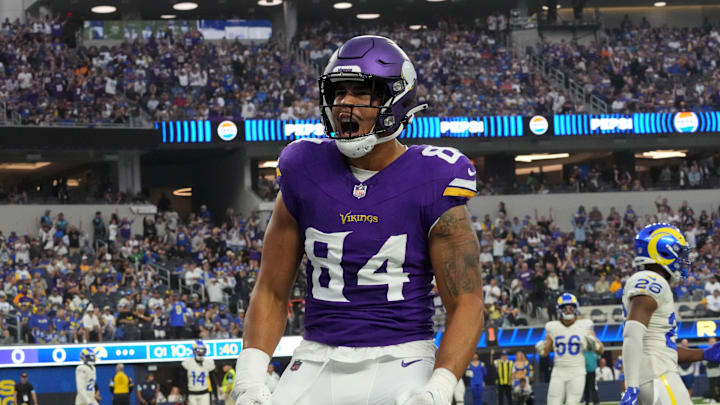 Oct 24, 2024; Inglewood, California, USA; Minnesota Vikings tight end Josh Oliver (84) celebrates after scoring on a 5-yard touchdown pass against the Los Angeles Rams in the first half at SoFi Stadium. Mandatory Credit: Kirby Lee-Imagn Images