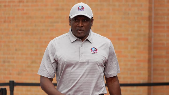 Aug 6, 2022; Canton, OH, USA; Tim Brown arrives on the red carpet during the Pro Football Hall of Fame Class of 2022 Enshrinement at Tom Benson Hallof Fame Stadium. 