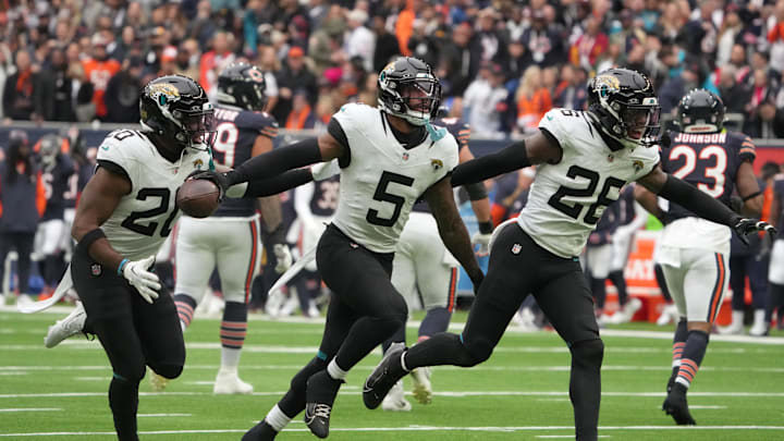 Oct 13, 2024; London, United Kingdom; Jacksonville Jaguars safety Andre Cisco (5) and safety Antonio Johnson (26) celebrate after an interception against the Chicago Bears in the first half during an NFL International Series game at Tottenham Hotspur Stadium. Mandatory Credit: Kirby Lee-Imagn Images Oct 13, 2024; London, United Kingdom; Jacksonville Jaguars safety Andre Cisco (5) and safety Antonio Johnson (26) celebrate after an interception against the Chicago Bears in the first half during an NFL International Series game at Tottenham Hotspur Stadium. Mandatory Credit: Kirby Lee-Imagn Images