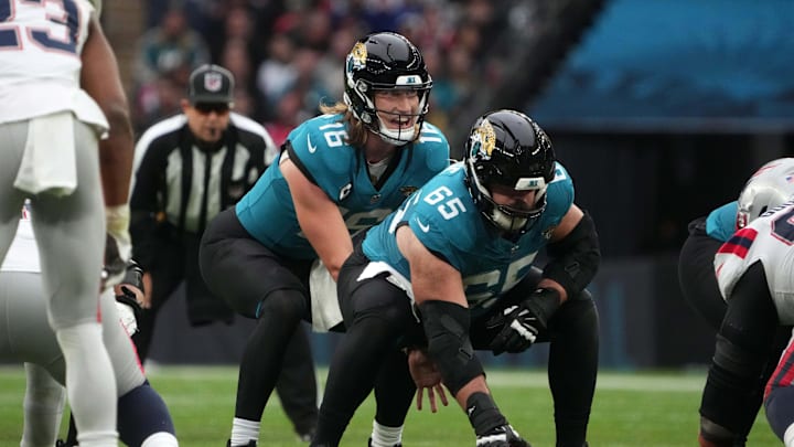 Oct 20, 2024; London, United Kingdom; Jacksonville Jaguars quarterback Trevor Lawrence (16) prepares to take the snap from center Mitch Morse (65) against the New England Patriots in the second half of an NFL International Series game at Wembley Stadium. Mandatory Credit: Kirby Lee-Imagn Images