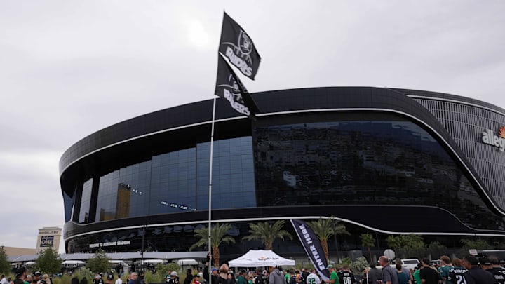 Oct 24, 2021; Paradise, Nevada, USA; A Las Vegas Raiders fan waves a flag during tailgate festivities before the game against the Philadelphia Eagles  at Allegiant Stadium. Mandatory Credit: Kirby Lee-Imagn Images
