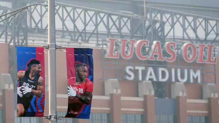 Mar 3, 2024; Indianapolis, IN, USA; Banners featuring images of running back Bijan Robinson (left) and receiver Zay Flowers at the 2024 NFL Scouting Combine at Lucas Oil Stadium. Mandatory Credit: Kirby Lee-Imagn Images