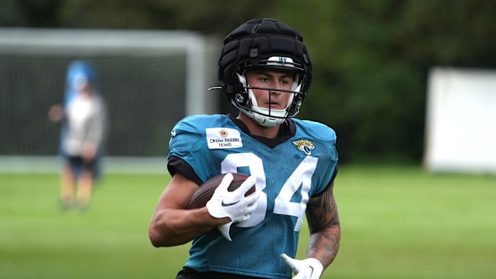 Oct 17, 2024; Watford, United Kingdom; Jacksonville Jaguars wide receiver Louis Rees-Zammit (84) wears a Guardian helmet cap during practice at The Grove. Mandatory Credit: Kirby Lee-Imagn Images