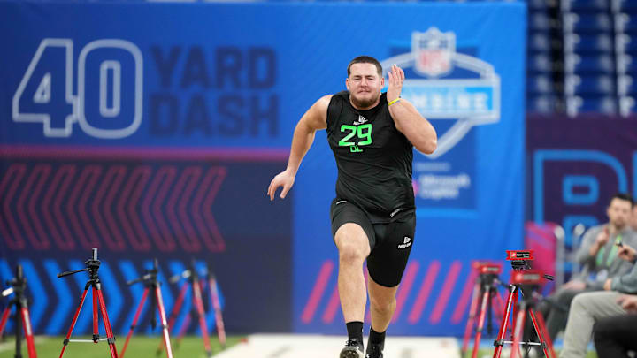 Mar 2, 2025; Indianapolis, IN, USA; West Virginia offensive lineman Wyatt Milum (OL29) runs in the 40-yard dash during the 2025 NFL Scouting Combine at Lucas Oil Stadium. Mandatory Credit: Kirby Lee-Imagn Images