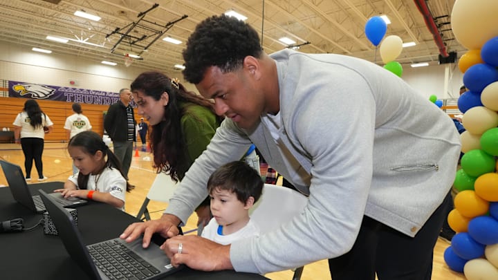 Apr 24, 2025; Green Bay, WI, USA; Jacksonville Jaguars defensive end Arik Armstead interacts with a student at the NFL Inspire Change Draft Event at Oneida Elementary School. Mandatory Credit: Kirby Lee-Imagn Images