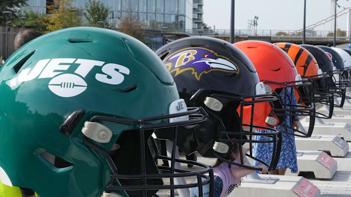 Oct 7, 2023; London, United Kingdom; Large oversized helmets of the New York Jets Baltimore Ravens, Cleveland Browns and Cincinnati Bengals at the NFL Experience London at the Battersea Power Station. Mandatory Credit: Kirby Lee-Imagn Images