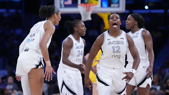 Jul 29, 2025; Los Angeles, California, USA; Las Vegas Aces center A'ja Wilson (22) and guard Chelsea Gray (12) celebrate in the first half against the LA Sparks at Crypto.com Arena. 