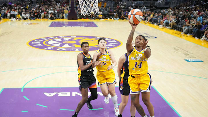 Sep 17, 2024; Los Angeles, California, USA; LA Sparks guard Crystal Dangerfield (14) shoots the ball against the Phoenix Mercury in the second half at Crypto.com Arena. Mandatory Credit: Kirby Lee-Imagn Images