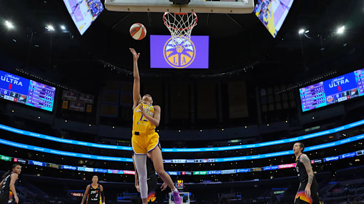 Sep 17, 2024; Los Angeles, California, USA; LA Sparks guard Rae Burrell (12) shoots the ball in the second half against the Phoenix Mercury  at Crypto.com Arena. Mandatory Credit: Kirby Lee-Imagn Images