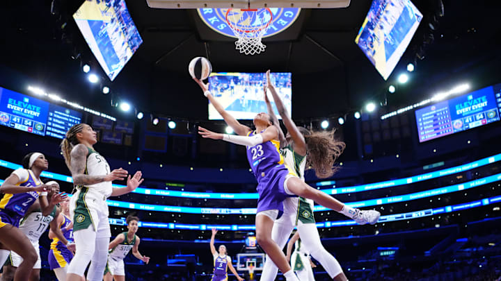 Jun 17, 2025; Los Angeles, California, USA; LA Sparks forward Azura Stevens (23) shoots the ball against Seattle Storm forward Ezi Magbegor (13) in the second half at Crypto.com Arena. Mandatory Credit: Kirby Lee-Imagn Images