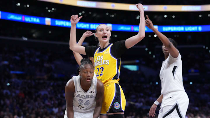 Jul 29, 2025; Los Angeles, California, USA; LA Sparks forward Cameron Brink (22) and Las Vegas Aces guard Jewell Loyd (24) react in the second half at the Crypto.com Arena. Mandatory Credit: Kirby Lee-Imagn Images